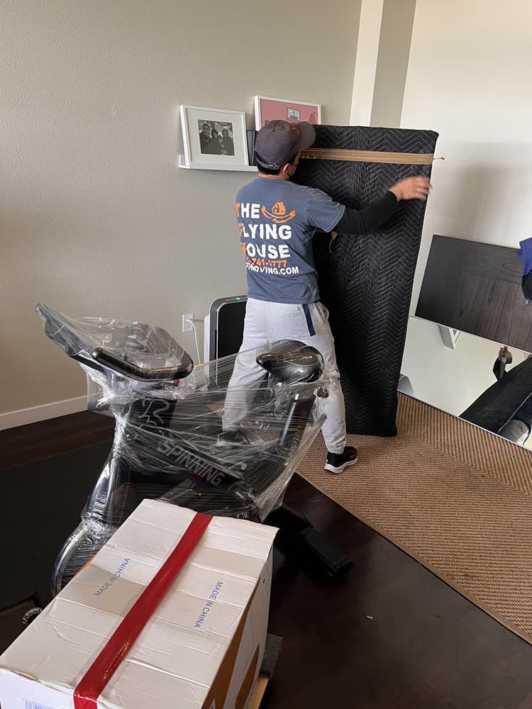 Professional packers wrapping items