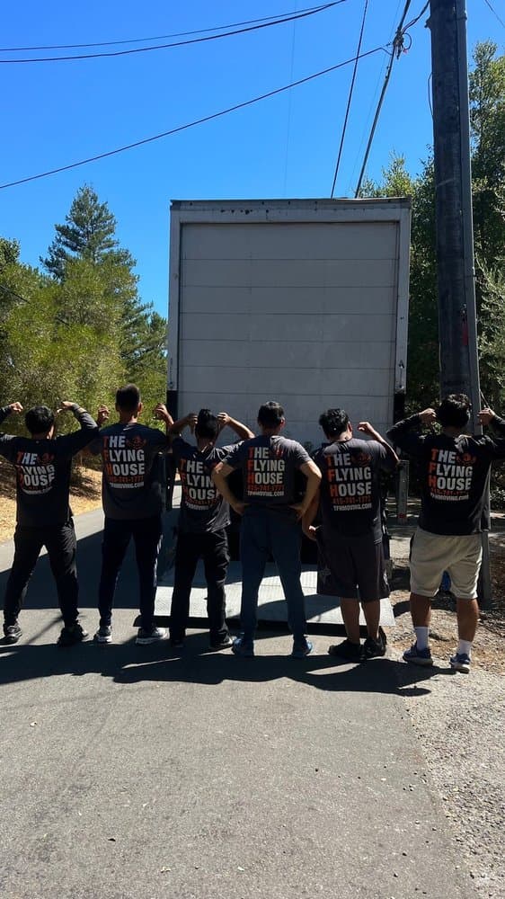 The Flying House Moving Services moving crew at the truck